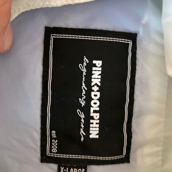 This is a tight fitting, gently used XL Pink+Dolphin Windbreaker. - Picture 2 of 5